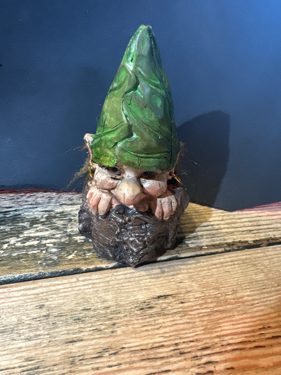 Elf on a stone with green hat