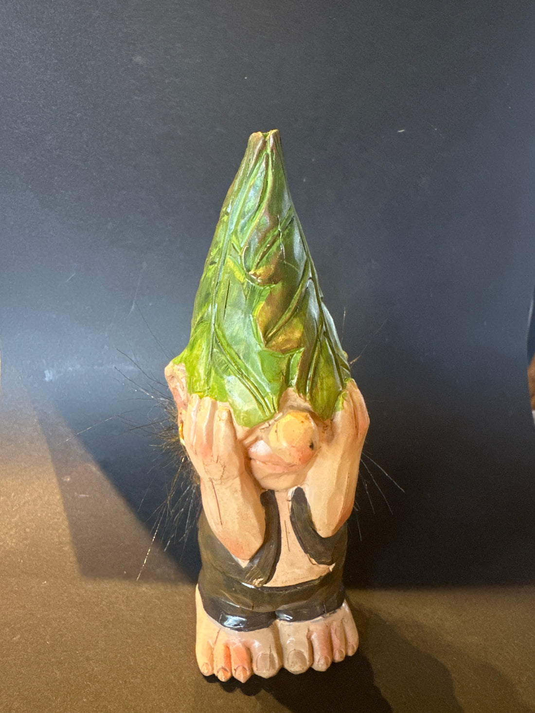 Elf with hands on his eyes